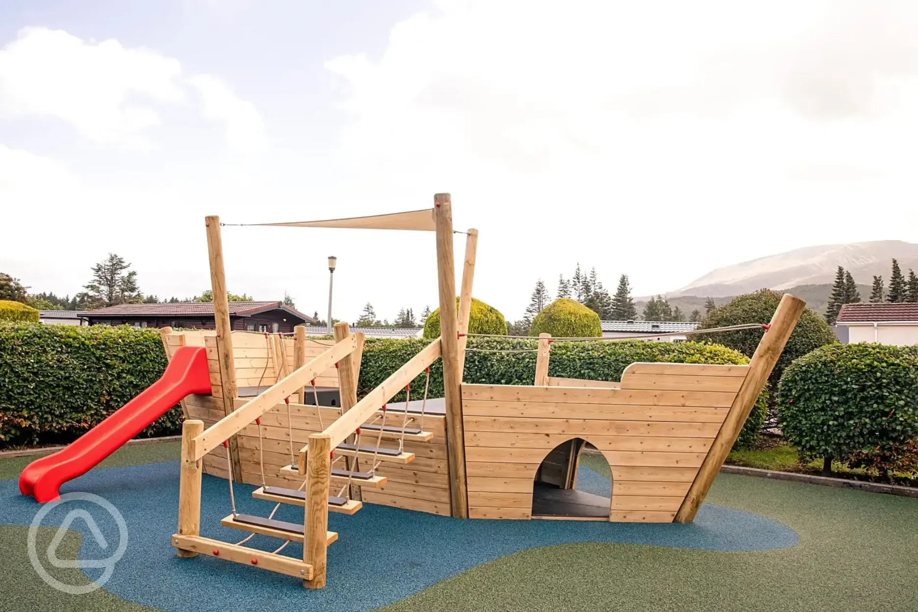 Children's playground with pirate ship and slide