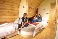 Ensuite glamping pod double bed and single sofa bed (bedding available for hire)