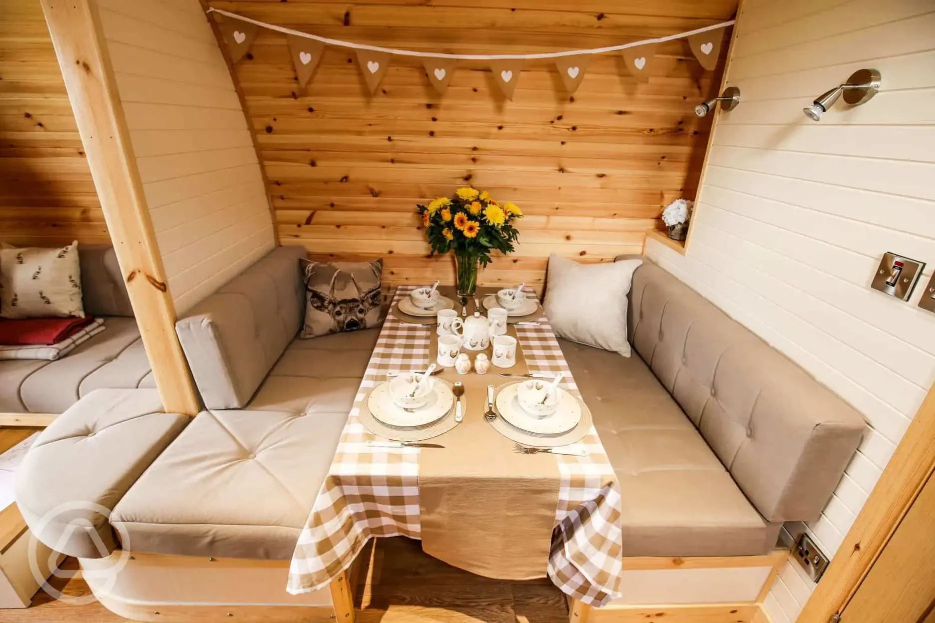 Glamping pod interior- dining table that converts into a bed