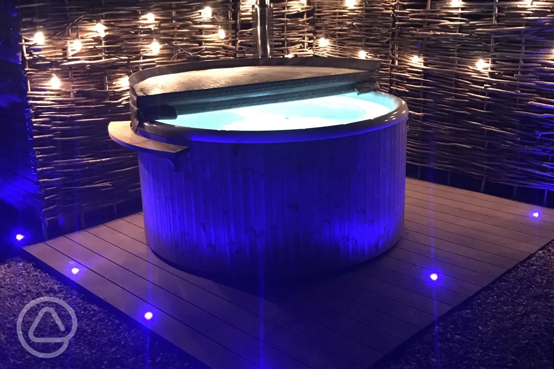 Glamping pod hot tub at night