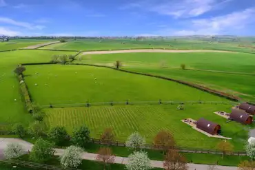 Aerial of Wingbury Farm Glamping overlooking the countryside
