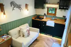 Oakley horsebox sofa and kitchen area with gas burner hob, fridge and microwave Oakley horsebox sofa and kitchen area with gas burner hob, fridge and microwave