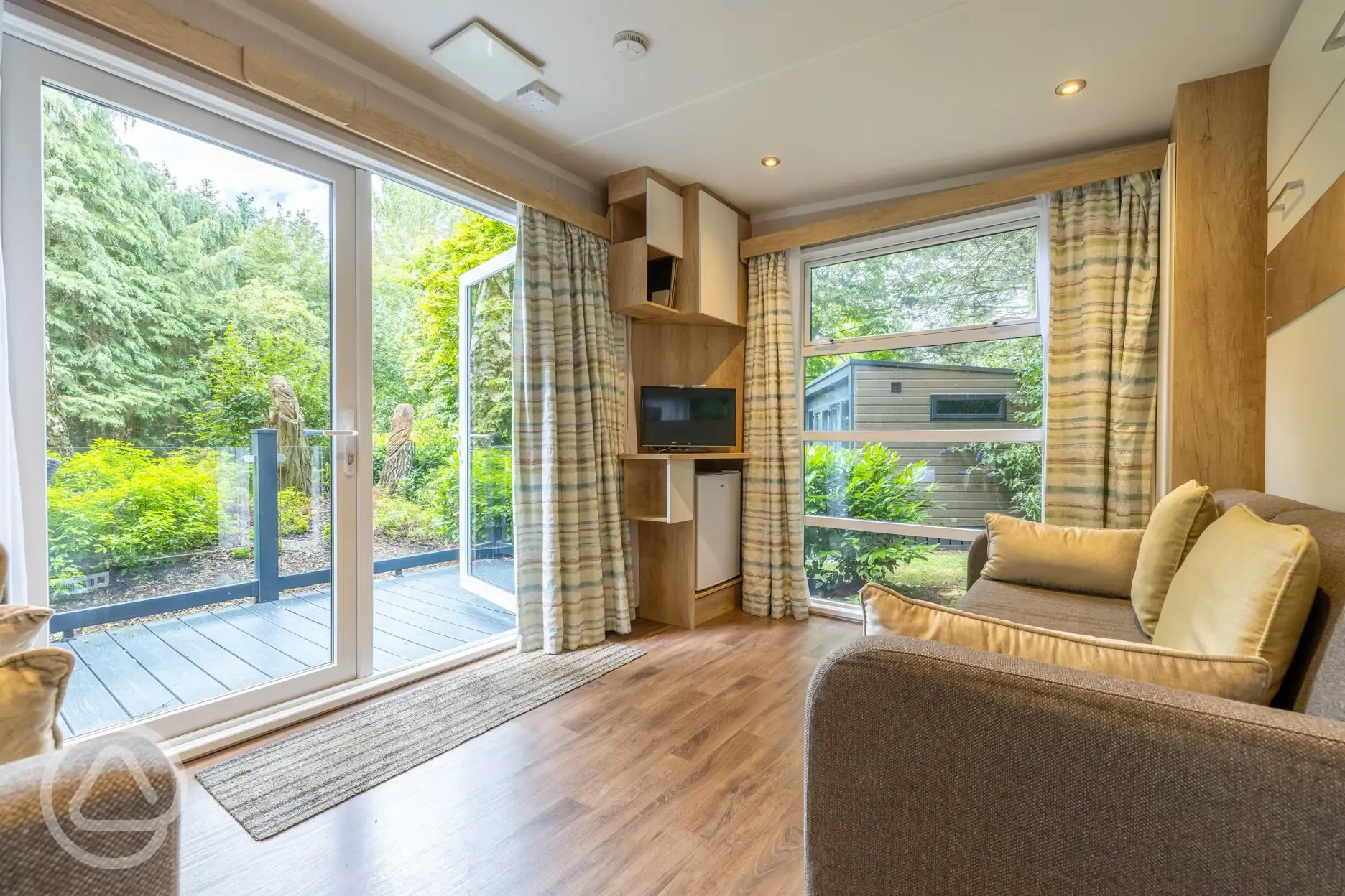 Studio pod cabin living area with a TV and DVD player Studio pod cabin living area with a TV and DVD player