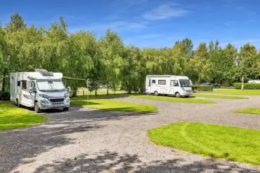 Electric hardstanding pitches (8m) with 16 amp hook up and awning space 