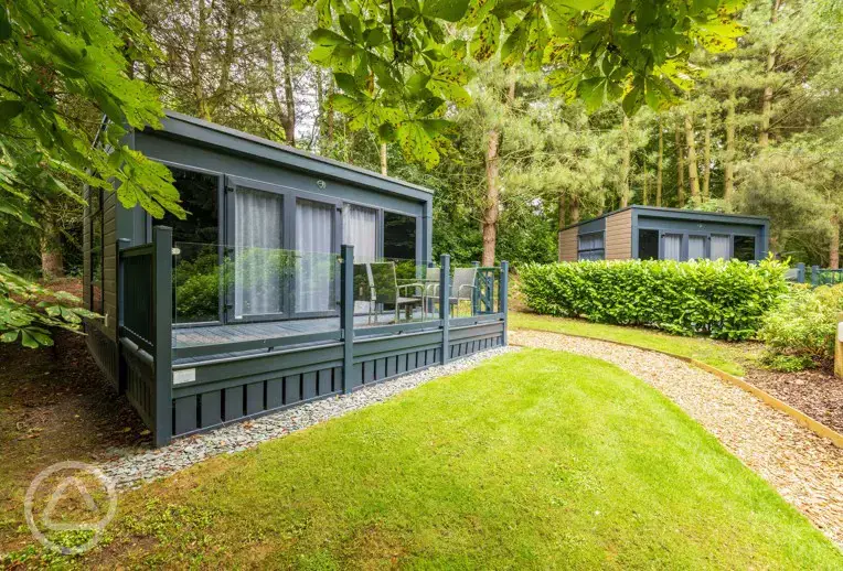 Studio pod ensuite cabin with private decking and outdoor seating 