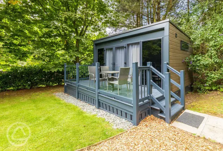 Studio pod ensuite cabin with private decking and outdoor seating 