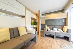 Studio pod cabin living area with double sofa bed and bunkbed Studio pod cabin living area with double sofa bed and bunkbed