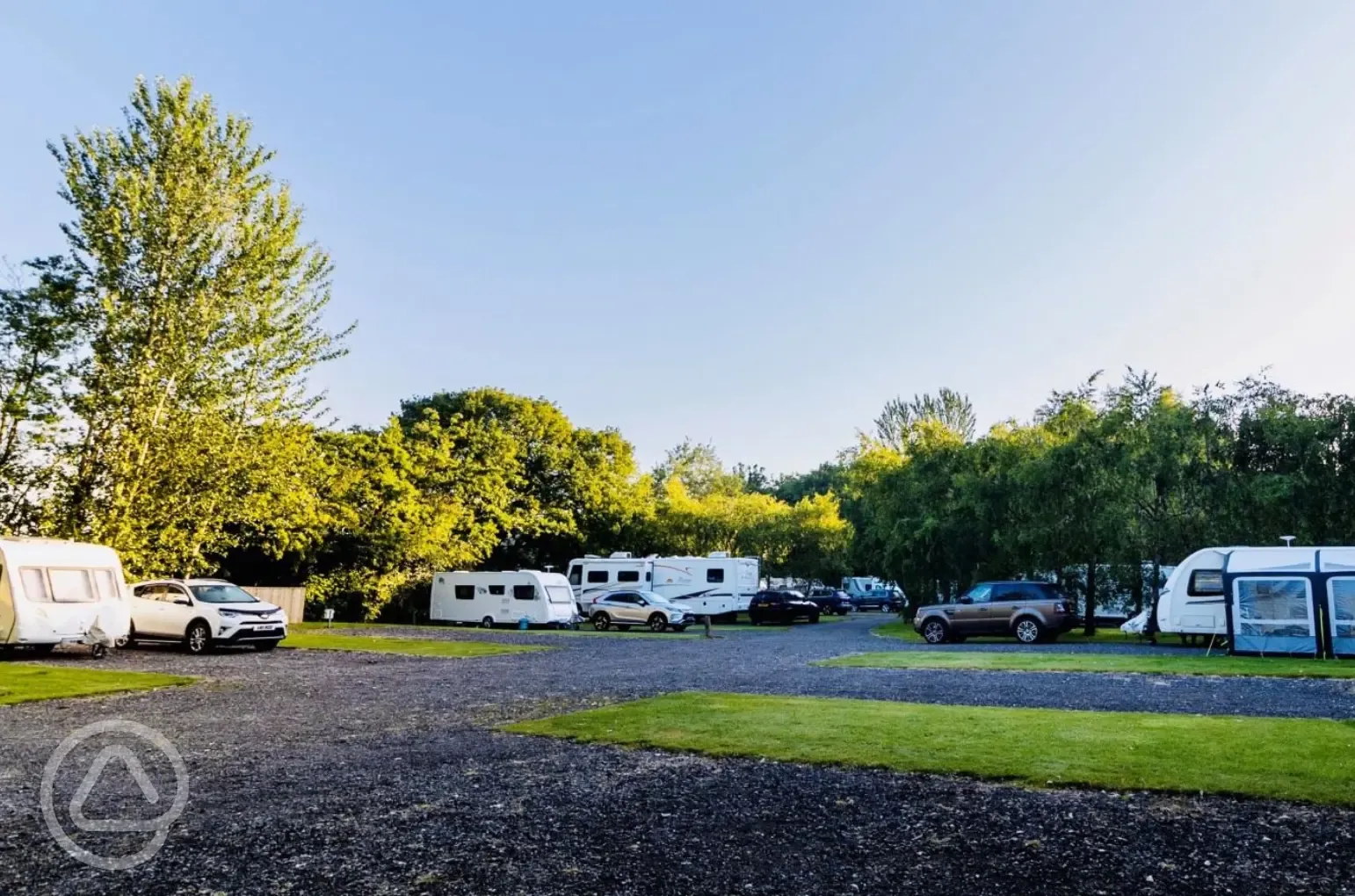 Caravans on electric hardstanding pitches (8m) with awning space Caravans on electric hardstanding pitches (8m) with awning space