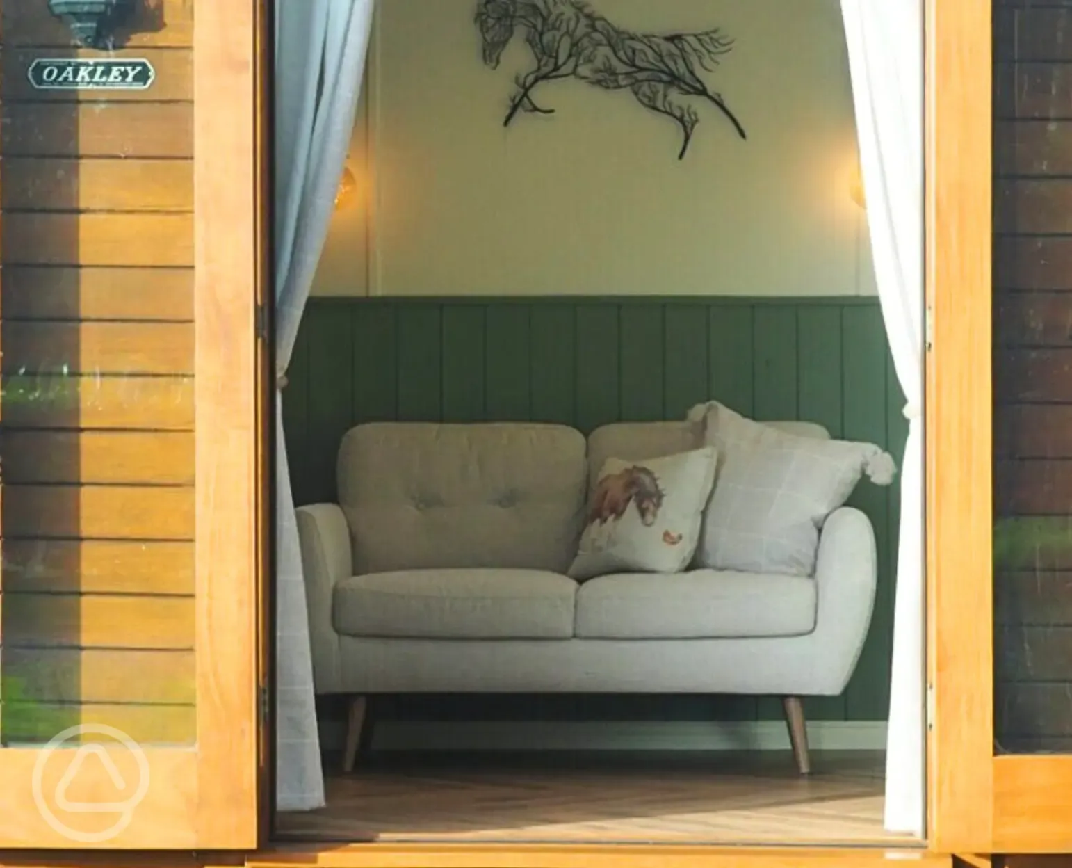 Oakley horsebox living area looking out at Nurseries Caravan Park Oakley horsebox living area looking out at Nurseries Caravan Park