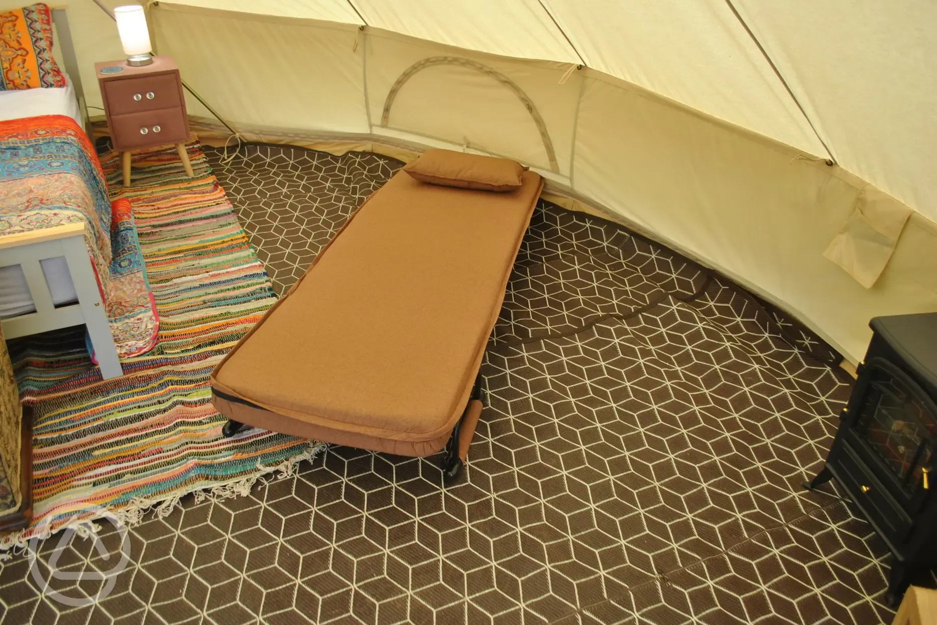 Rental Glamping Bell tent fold out single bed 