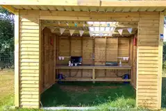 Premium pitch with a wooden kitchen shelter