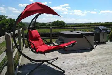 Decked area with swing chair