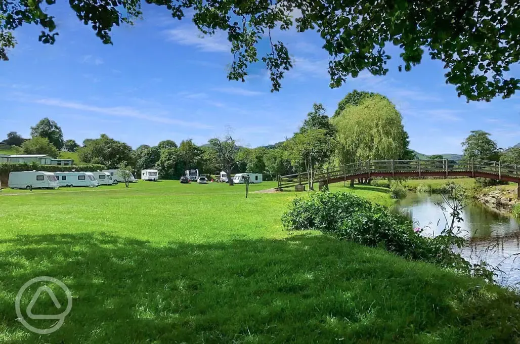 Electric grass pitches by the river