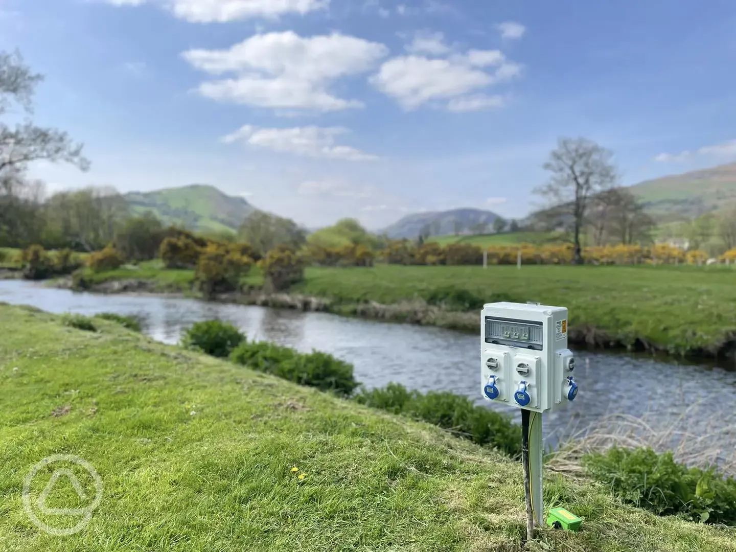 Electric grass pitches by the river