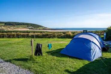 Tent on sea view grass pitch at Ocean Pitch Campsite
