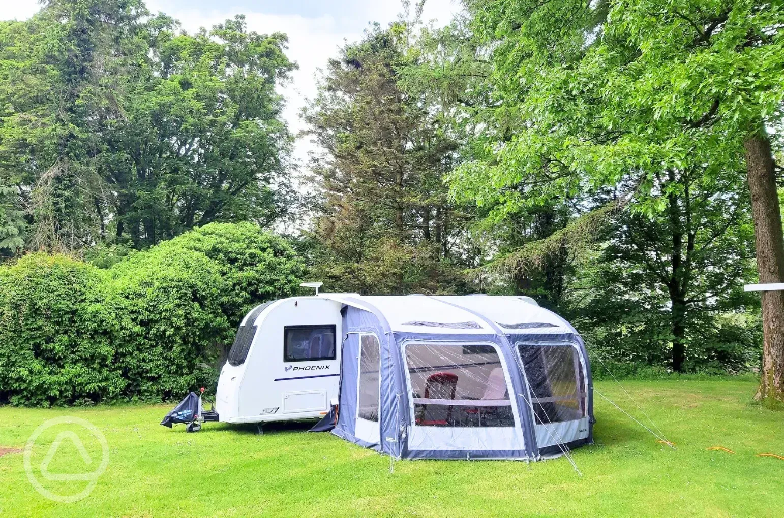 Fully serviced grass pitches with 16 amp hook up with awning space