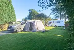 Fully serviced grass pitches with 16 amp hook up with awning space Fully serviced grass pitches with 16 amp hook up with awning space