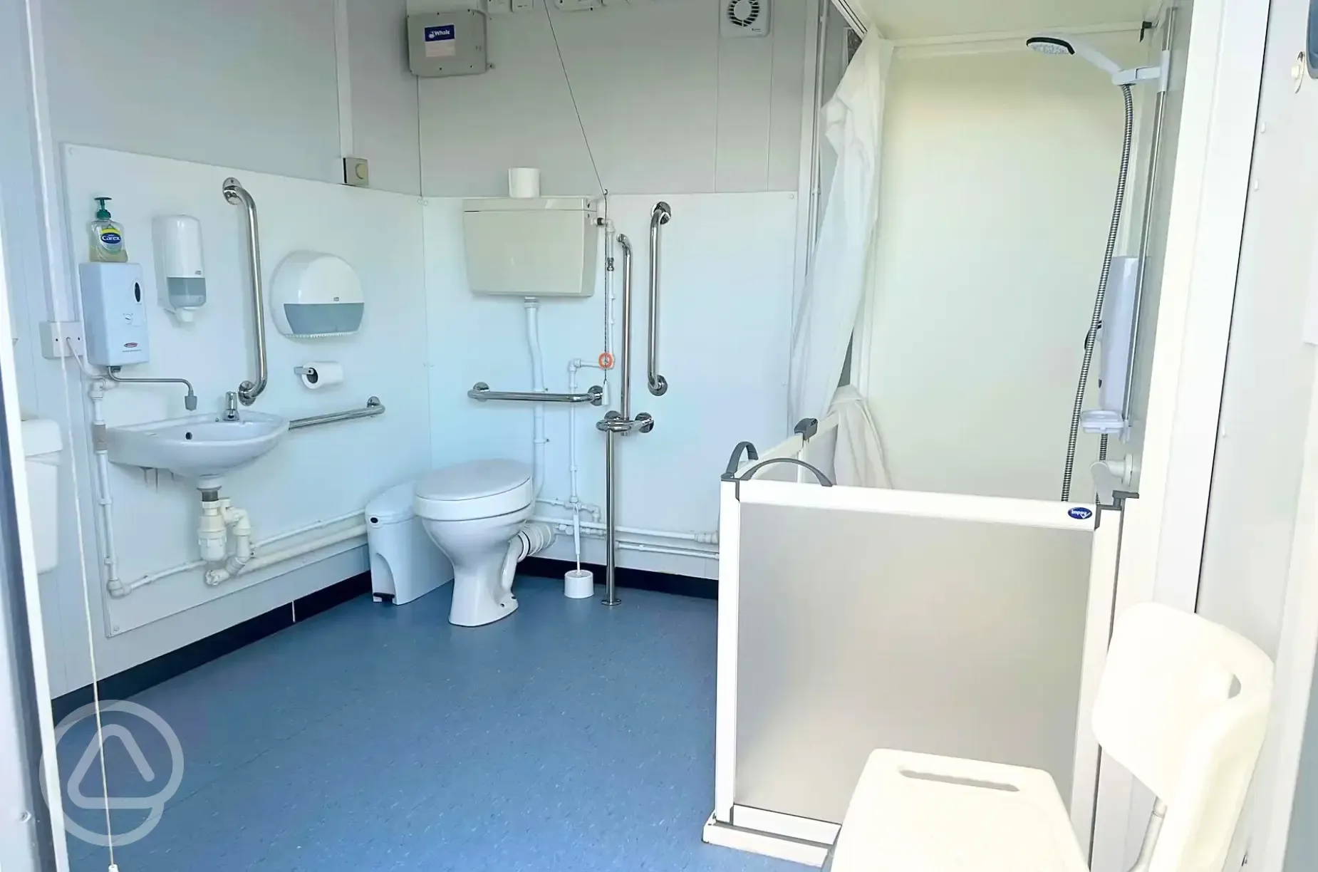 Accessible bathroom with grab rails and shower