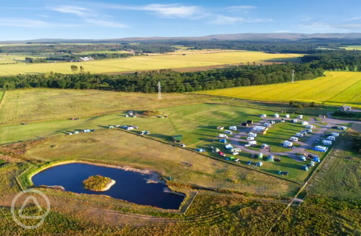 Aerial of Barrow Campsite Nairn and the onsite pond for paddleboarding lessons