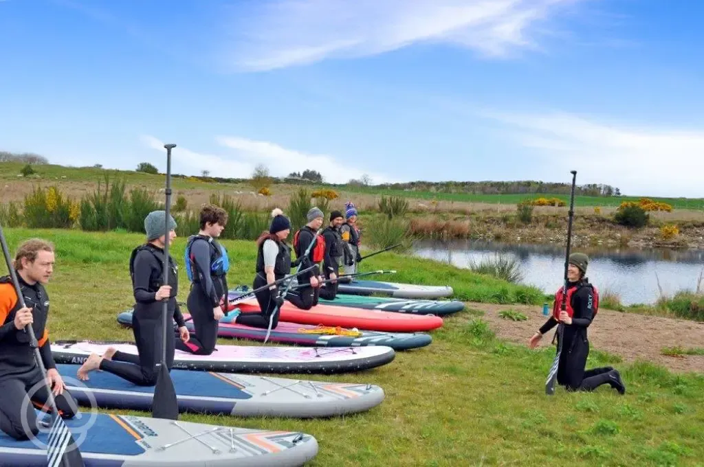Paddle board lessons available on the onsite pond