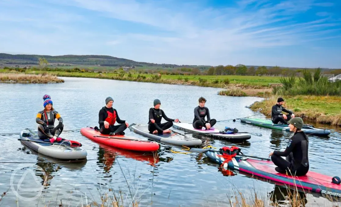 Paddle board lessons available on the onsite pond