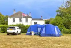 Non electric grass pitches with space for a parked car