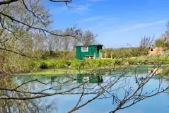 Otter's Nest shepherd's hut by the pond