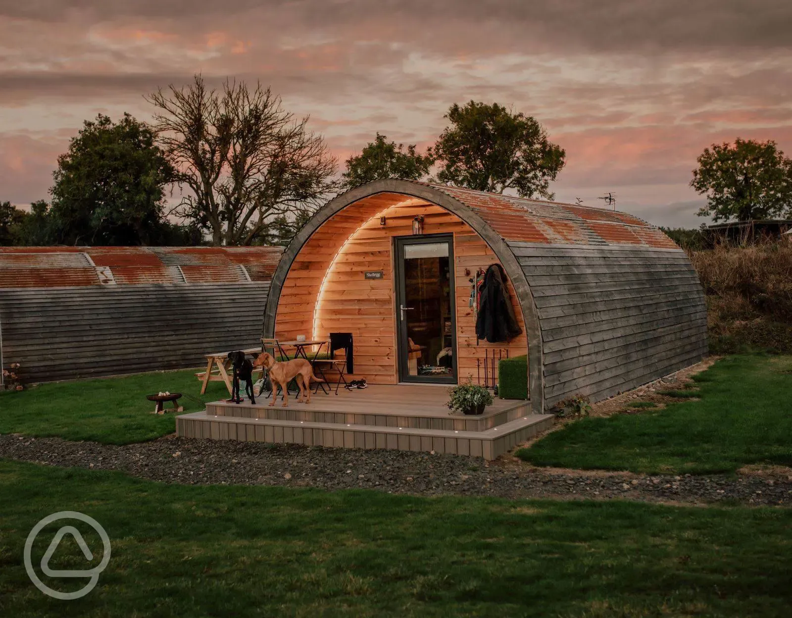 Luxury glamping pods at dusk