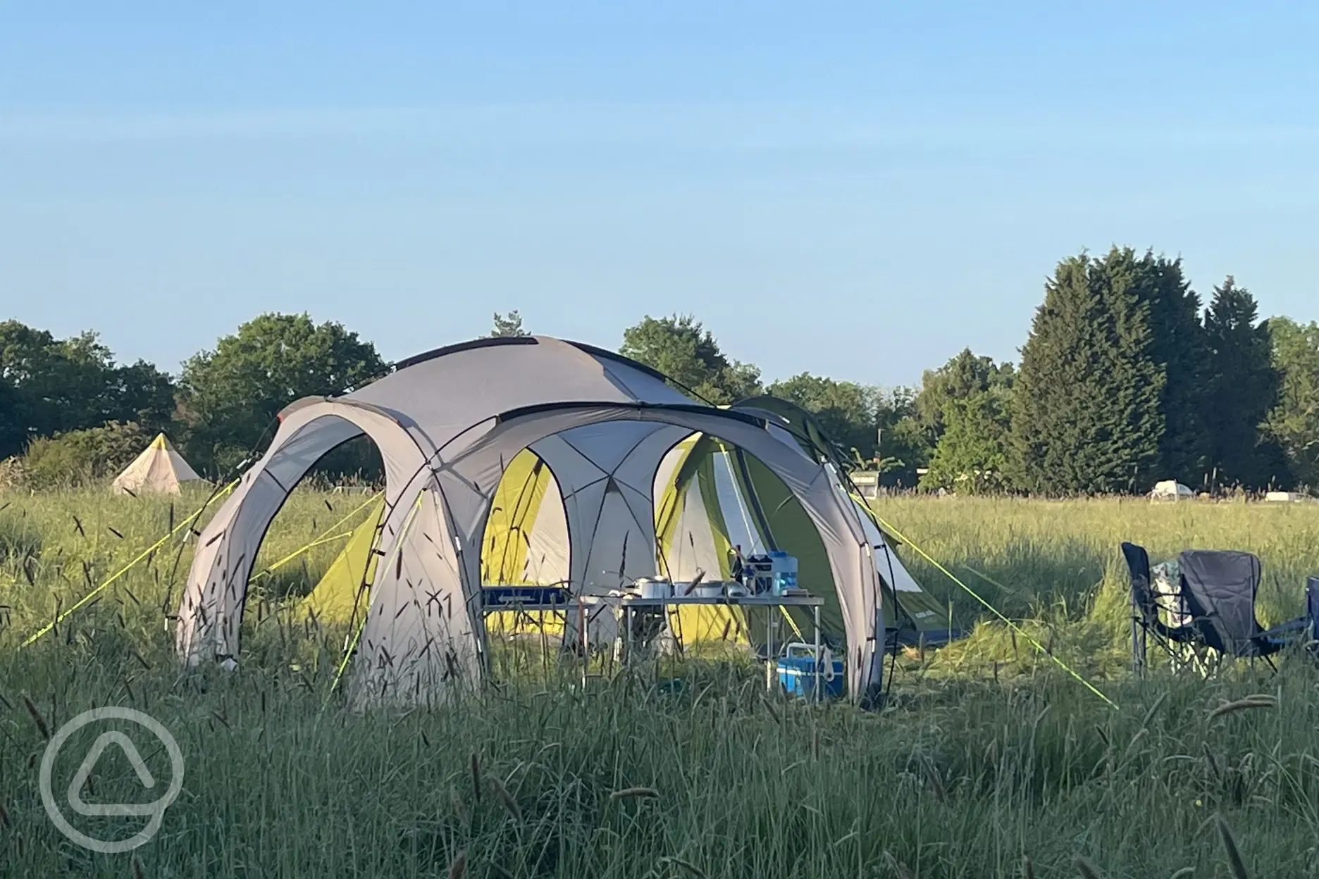 Non electric grass tent pitches with a gazebo