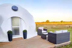 Glamping dome and neighbouring sheep