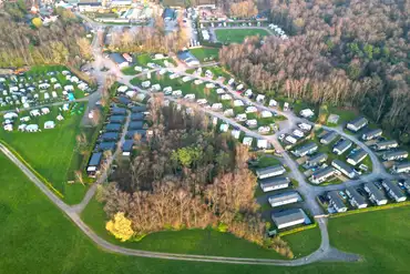 Aerial of Blakemere Holiday Park in Cheshire, surrounded by woodlands