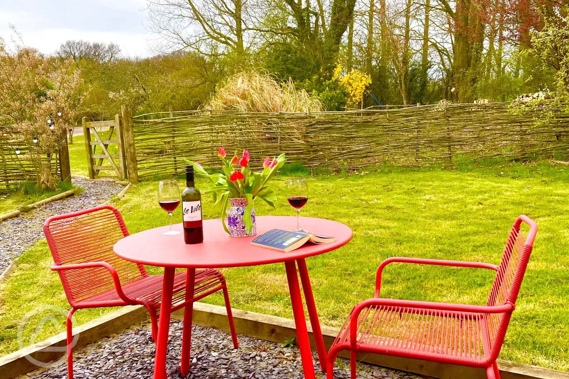 Pond view shepherd's hut outdoor dining area