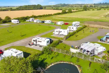 Aerial of Westgate Carr Farm Caravan and Motorhome Touring Park and countryside
