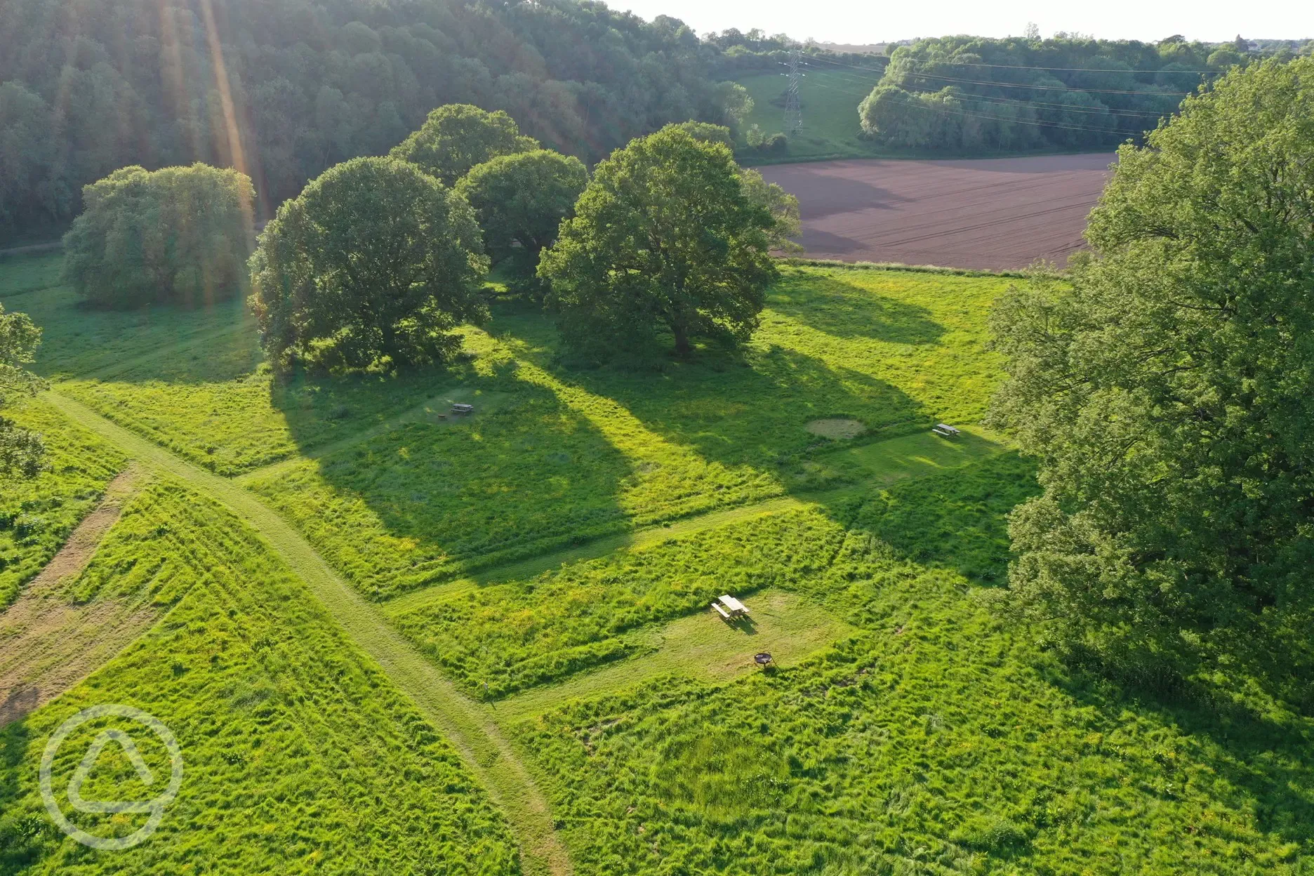 Aerial view of site with mown pitches