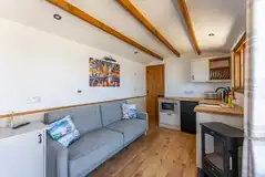 Shepherd's hut with a sofa bed and kitchen