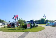 Electric grass pitches with a gravel track leading through the side