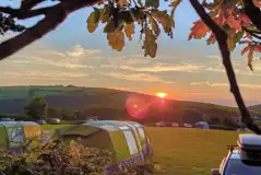 Non electric grass pitches (10m x 10m) at sunset