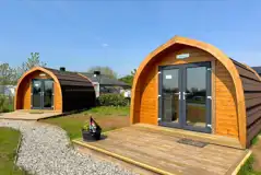 Camping pods with double doors and wooden decks