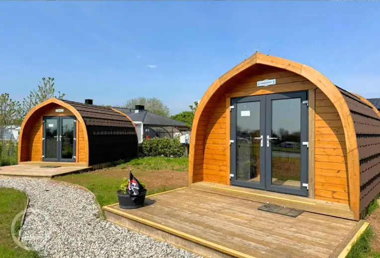 Camping pods with double doors and wooden decks