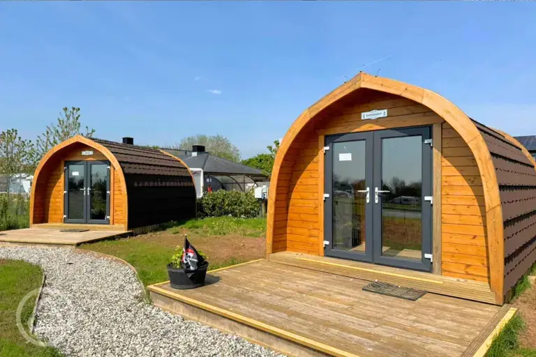 Camping pods with double doors and wooden decks