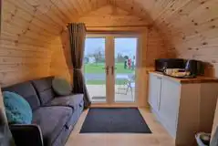 Camping pod with a double sofa bed, microwave, kettle and fridge