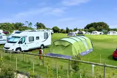 Electric grass pitches with tents and tourers welcome