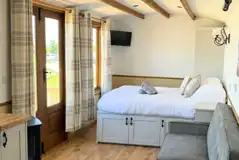 Hut king size bed and double sofa bed (bedding only provided for the king)