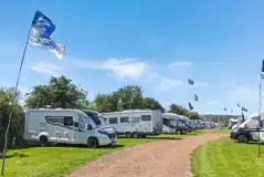 Motorhomes pitches up on electric grass pitches
