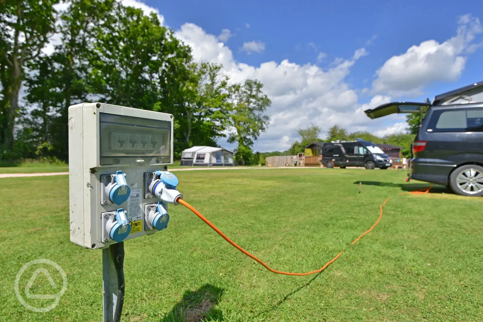 Electric grass pitches at Oakmoor Touring Park