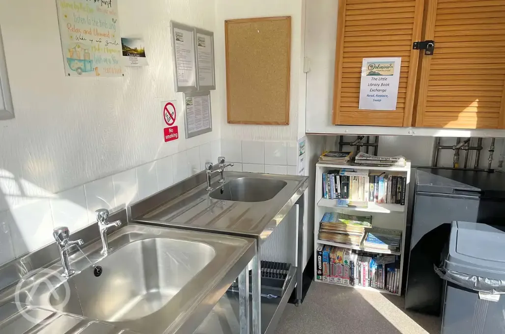 Washing up area with washing essentials provided at Oakmoor Touring Park