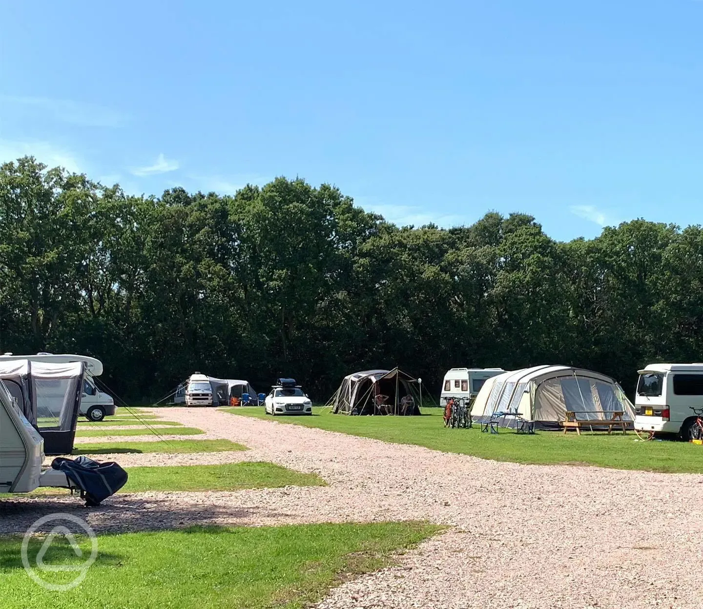Grass and hardstanding pitches with awning space at Oakmoor Touring Park