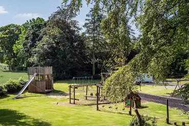 Adventure play park with climbing frames and a zip wire