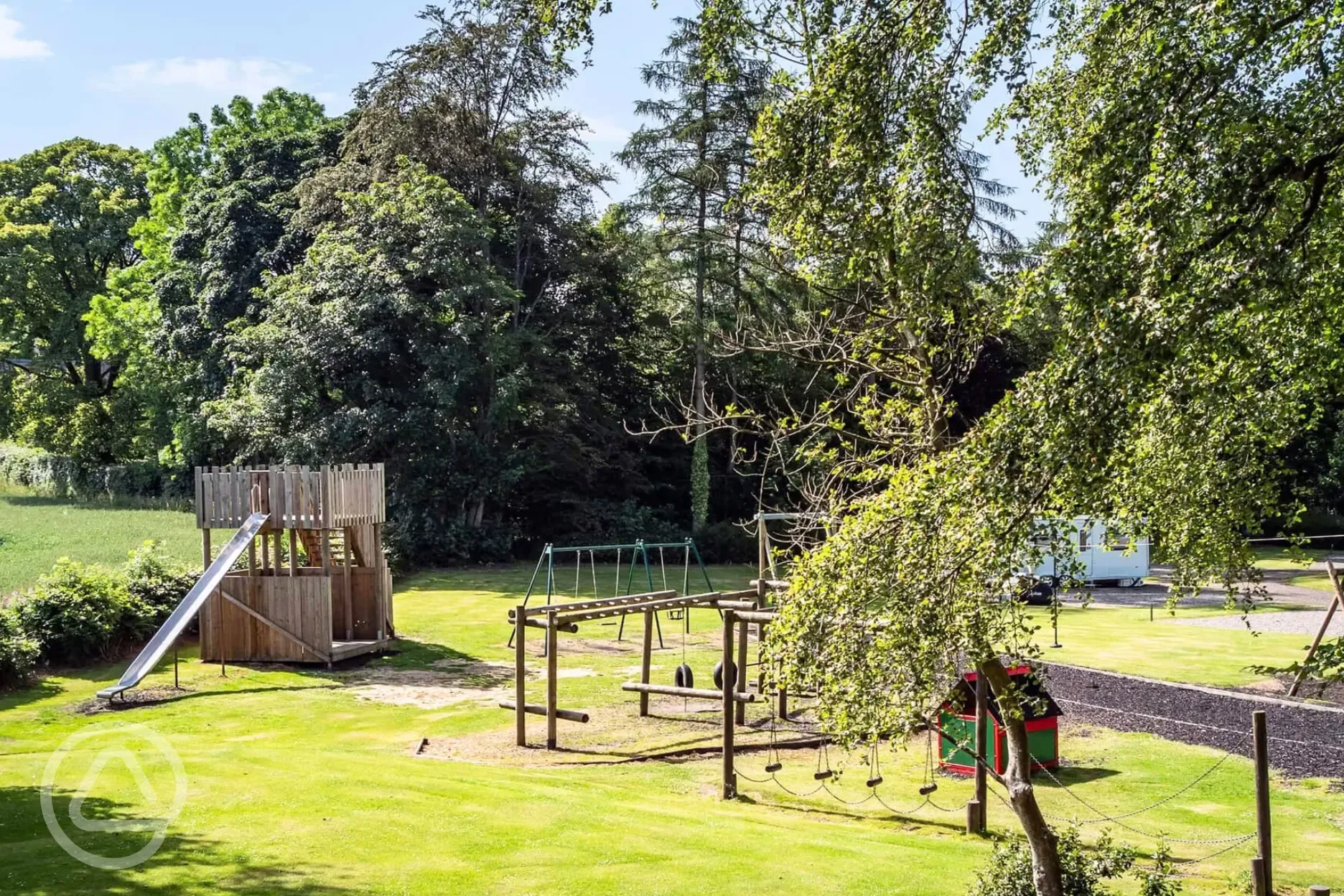 Adventure play park with climbing frames and a zip wire