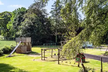 Adventure play park with climbing frames and a zip wire
